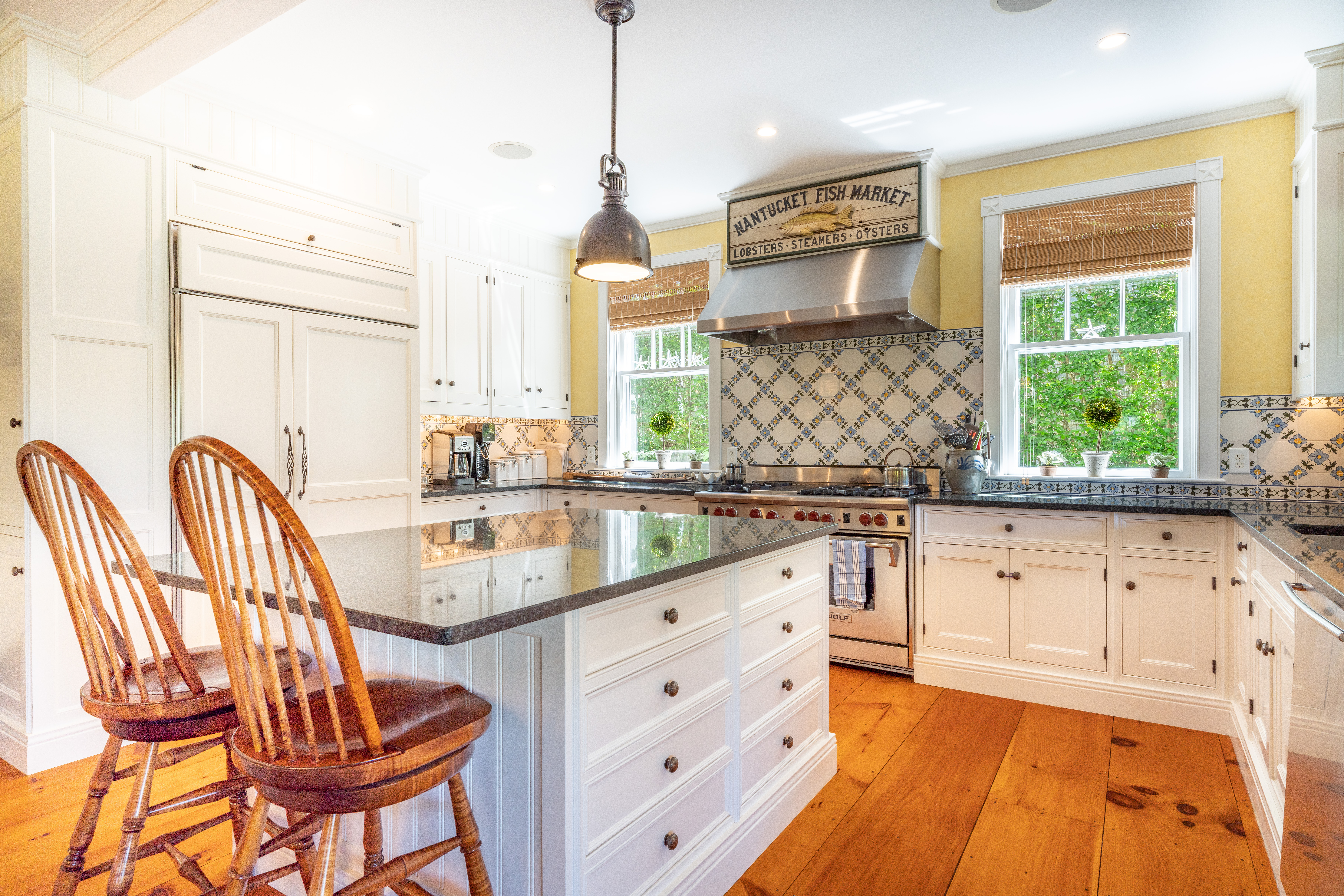 6 Ackermuck Road Nantucket, MA 02554 - Photo 11 of 40 a kitchen with stainless steel appliances granite countertop a stove a sink and a granite counter tops with white cabinets