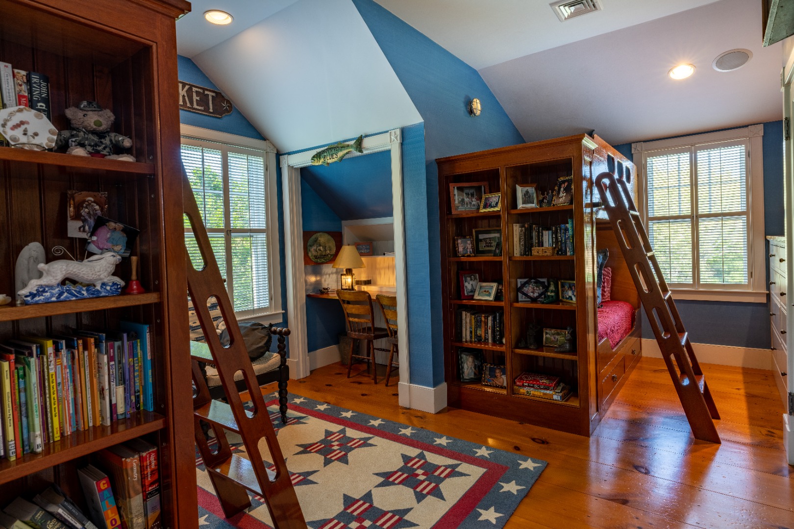 6 Ackermuck Road Nantucket, MA 02554 - Photo 19 of 40 a living room with lots of furniture and a book shelf