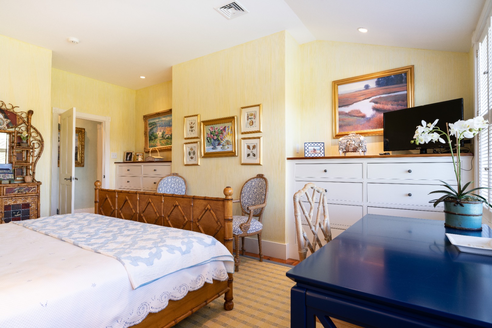 6 Ackermuck Road Nantucket, MA 02554 - Photo 23 of 40 a bedroom with a bed a table and potted plants