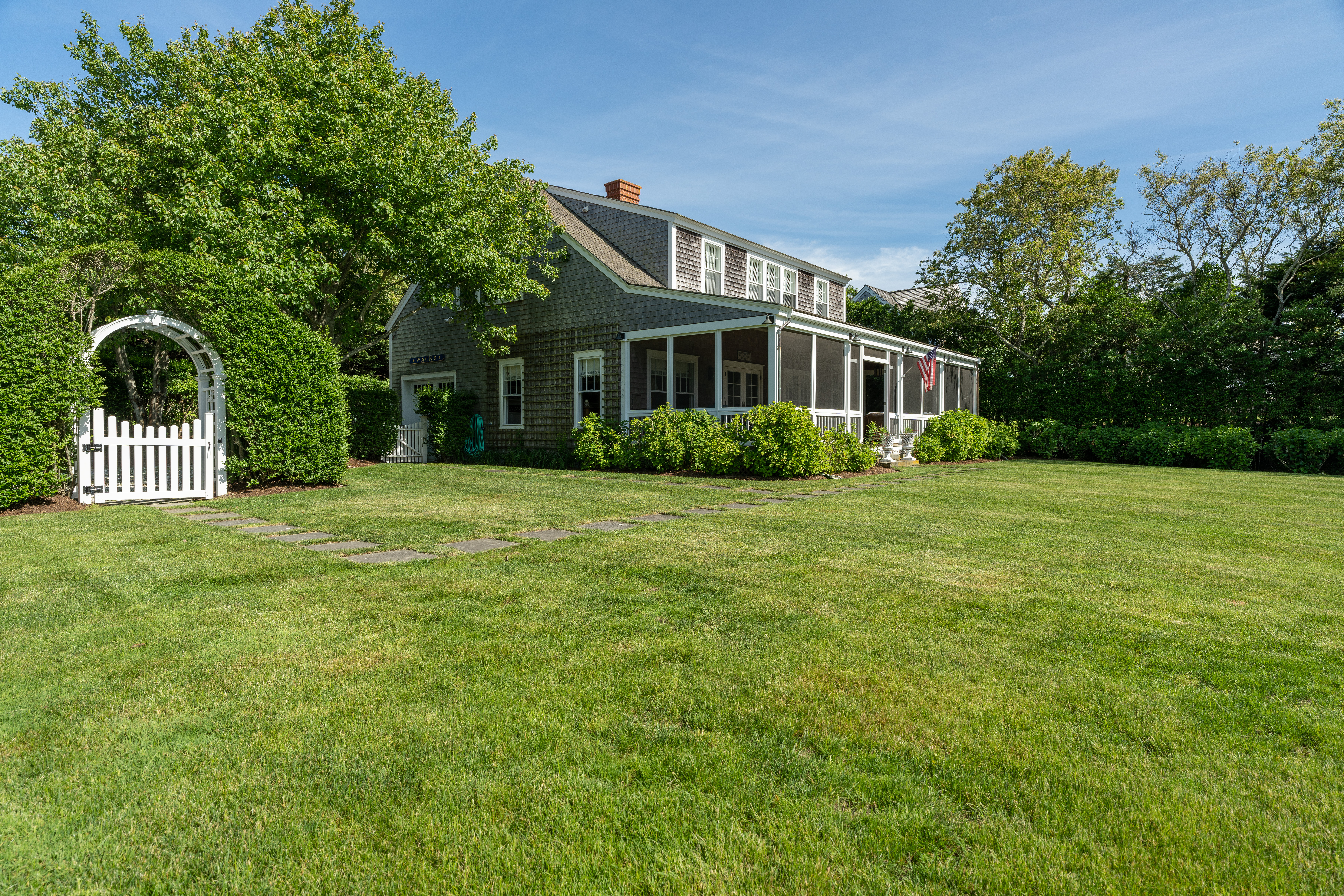 6 Ackermuck Road Nantucket, MA 02554 - Photo 40 of 40 a front view of a house with a garden