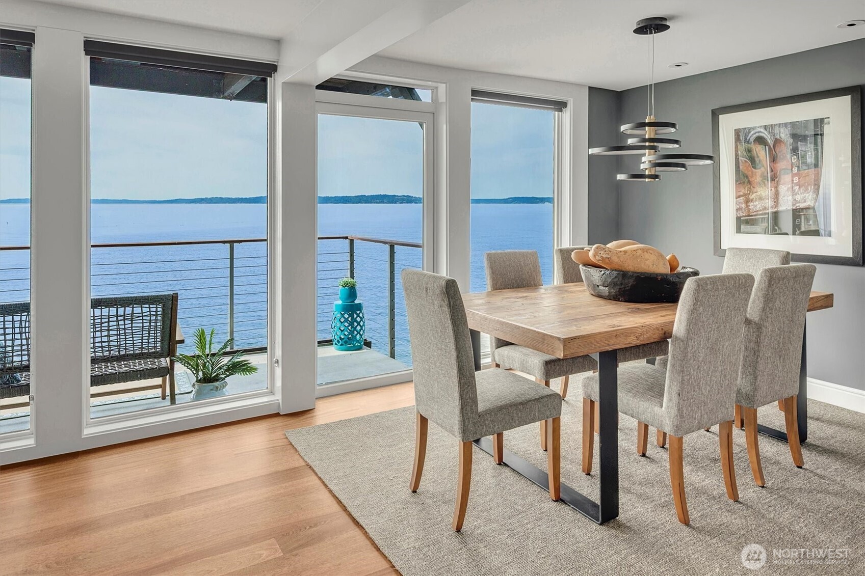 3717 Beach Drive Southwest, Unit 207 Seattle, WA 98116 - Photo 11 of 40 a view of a dining room with furniture and wooden floor