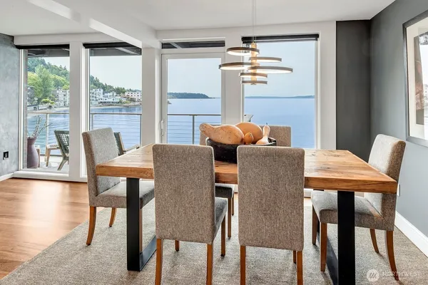 a view of a dining room with furniture window and outside view