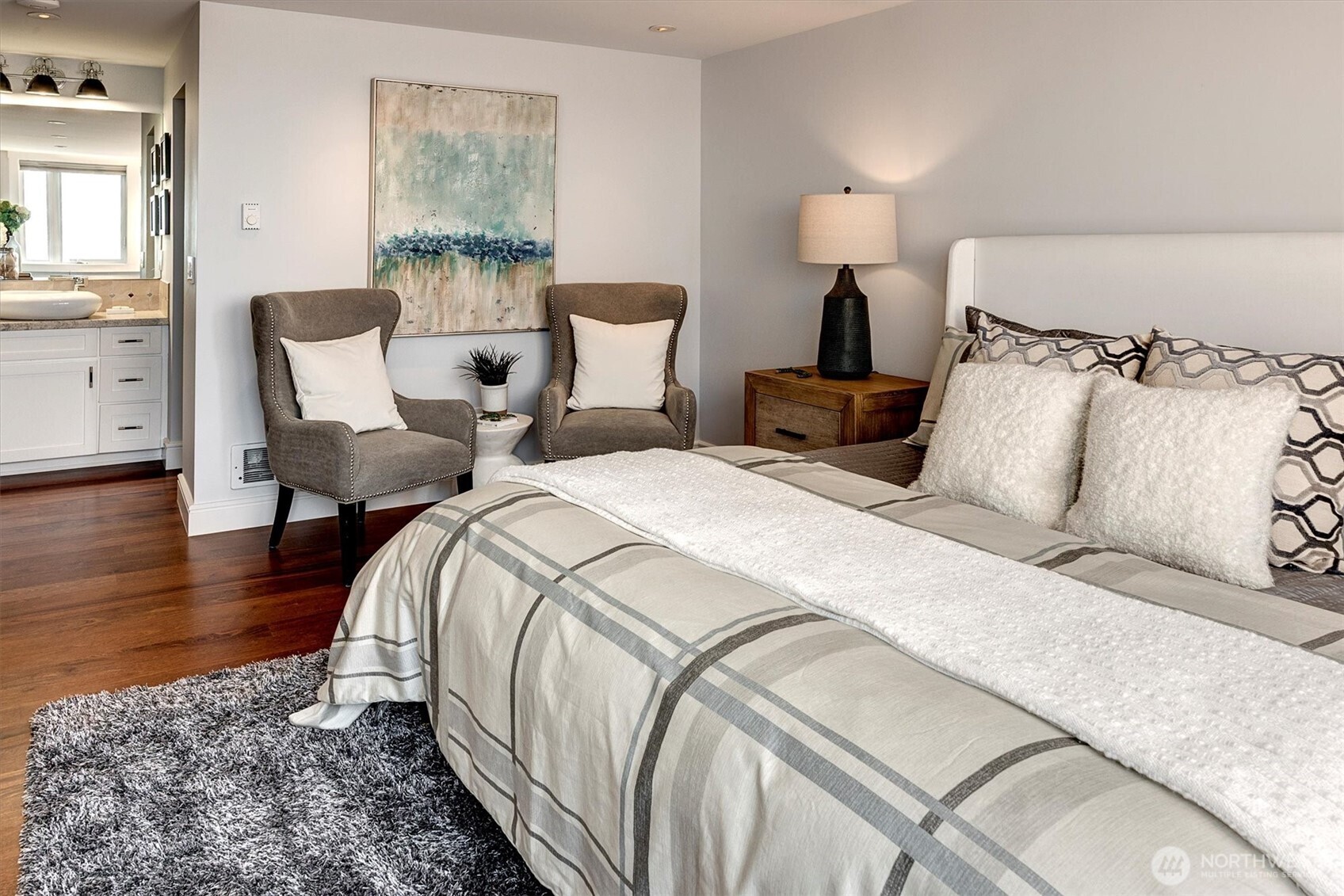 3717 Beach Drive Southwest, Unit 207 Seattle, WA 98116 - Photo 20 of 40 a bedroom with bed and wooden floor