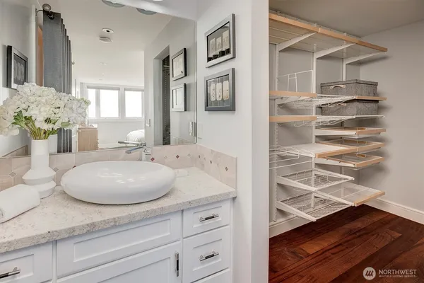 a bathroom with a sink and a mirror
