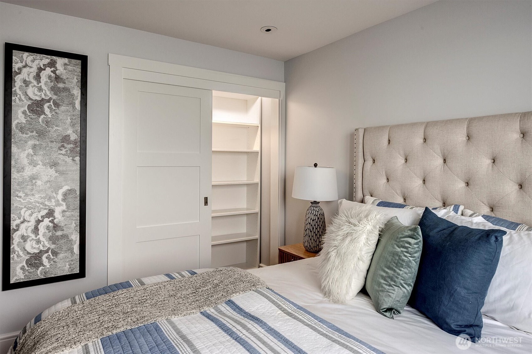 3717 Beach Drive Southwest, Unit 207 Seattle, WA 98116 - Photo 24 of 40 a bedroom with a bed and a window