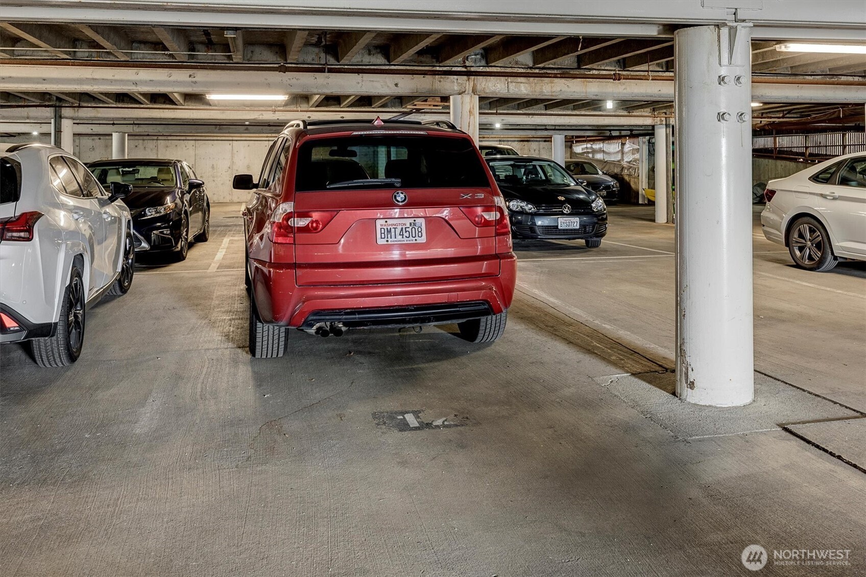 3717 Beach Drive Southwest, Unit 207 Seattle, WA 98116 - Photo 33 of 40 a view of parking garage with cars