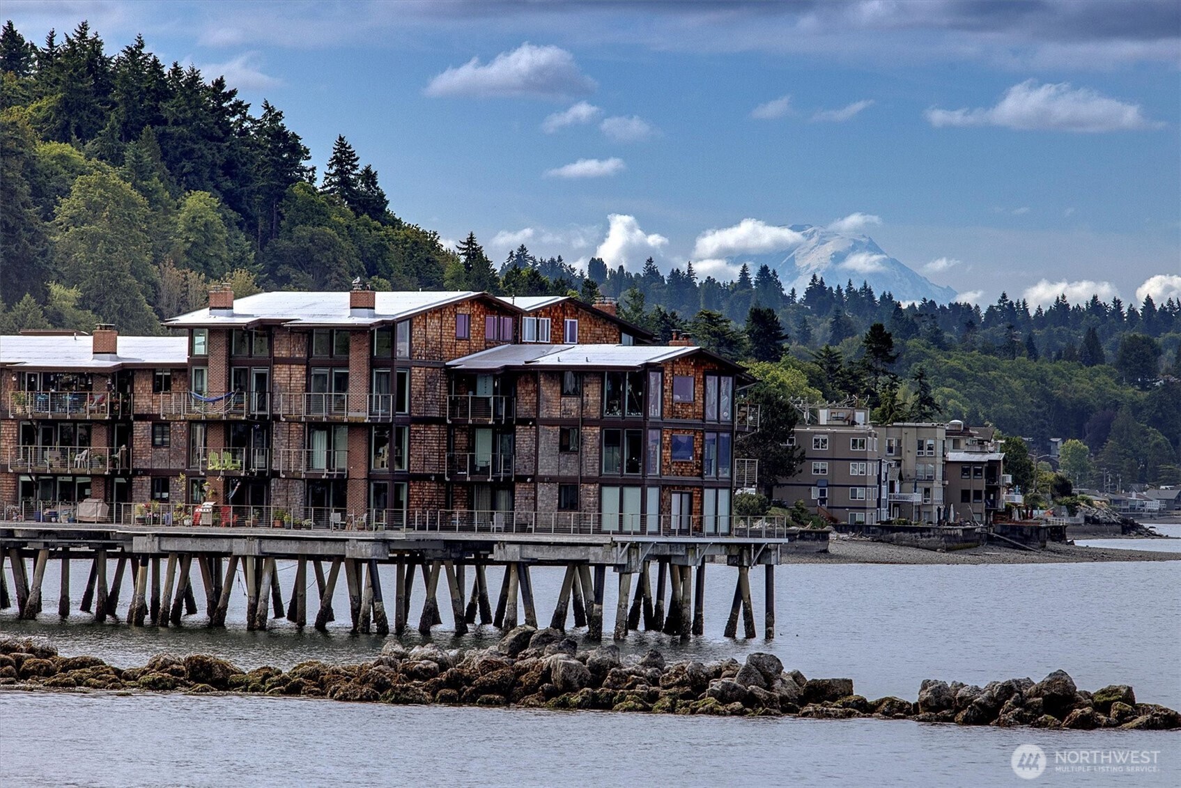3717 Beach Drive Southwest, Unit 207 Seattle, WA 98116 - Photo 37 of 40 a view of a house with a porch and furniture