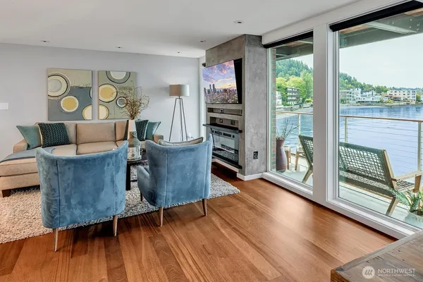 a living room with furniture and large windows