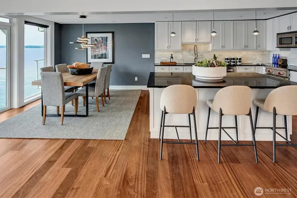 a view of a dining room with furniture and wooden floor