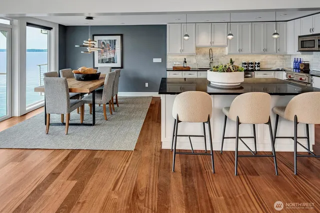 a view of a dining room with furniture and wooden floor