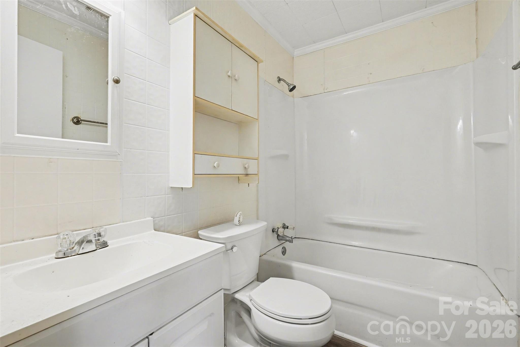 1813 Isaac Place Shelby, NC 28152 - Photo 11 of 14 a bathroom with a sink a toilet and shower