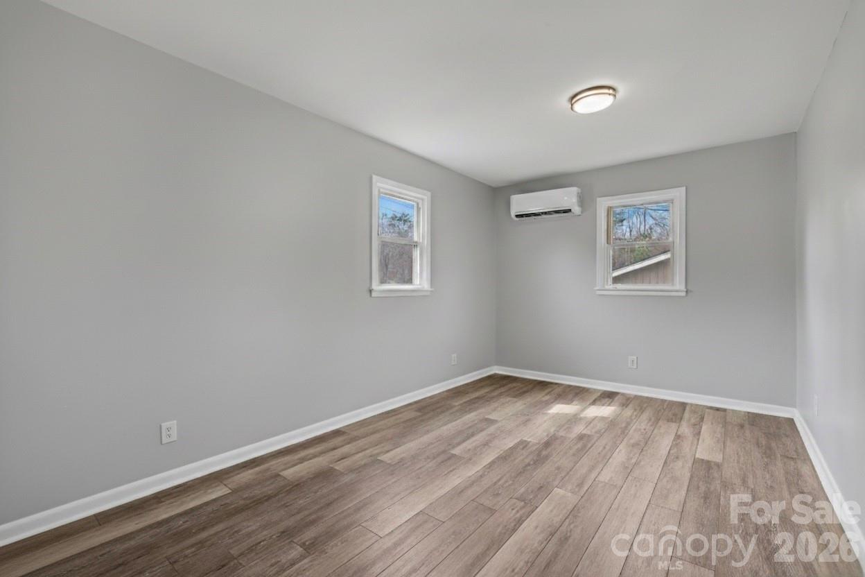 1813 Isaac Place Shelby, NC 28152 - Photo 12 of 14 a view of room with wooden floor and window