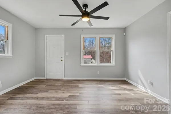 a view of room with window and ceiling fan