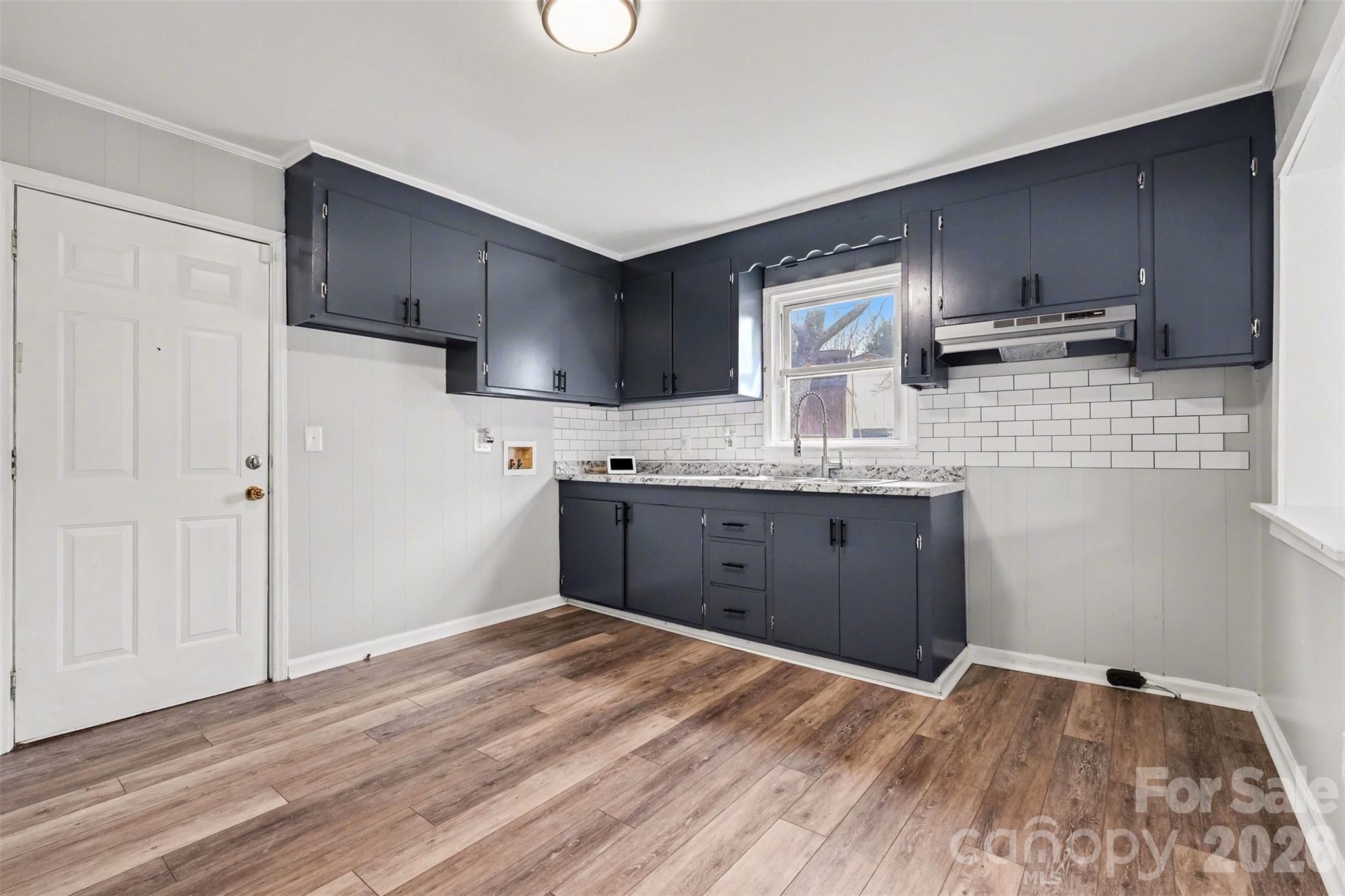 1813 Isaac Place Shelby, NC 28152 - Photo 5 of 14 a kitchen with stainless steel appliances granite countertop a sink stove and refrigerator