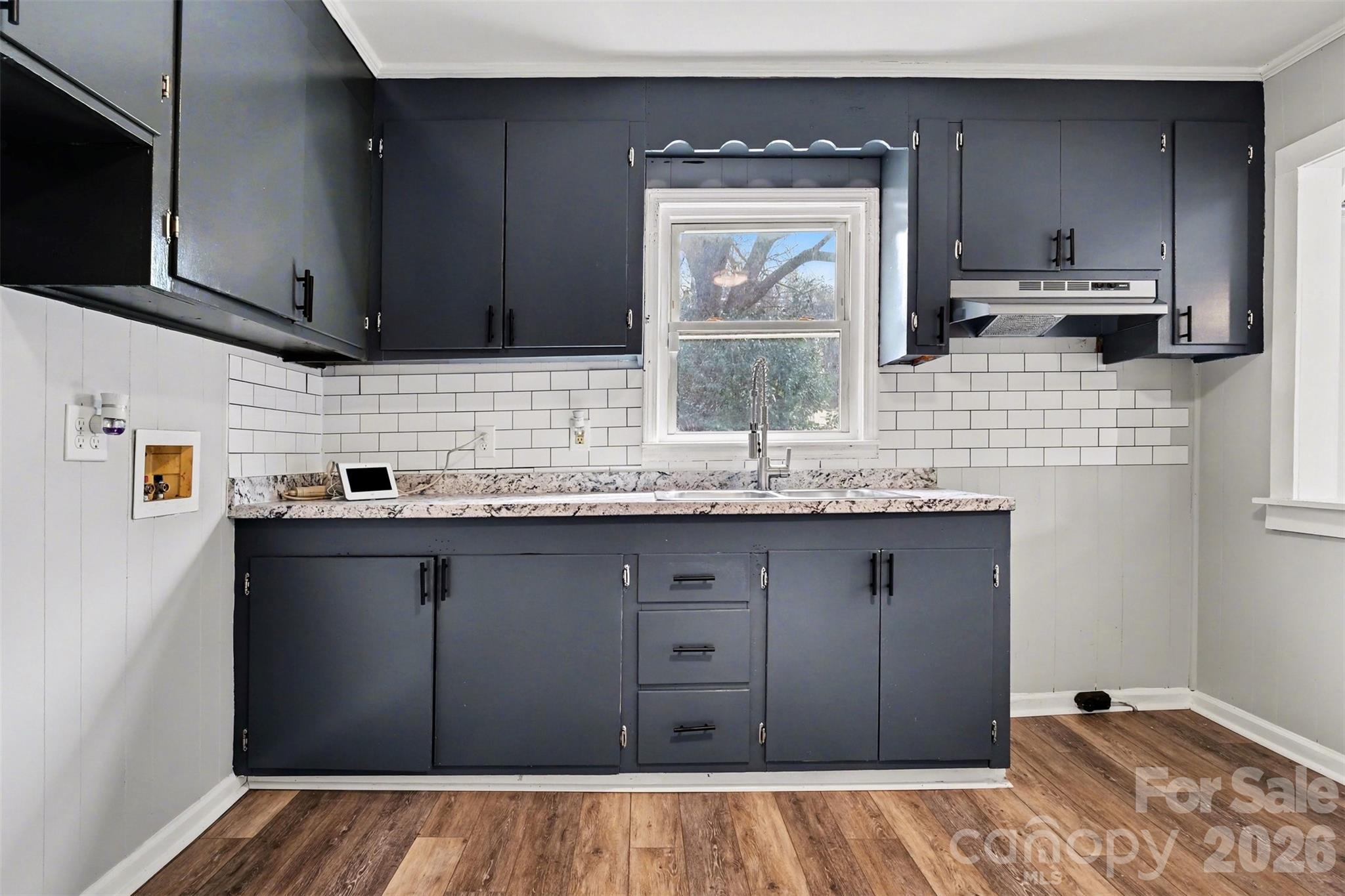 1813 Isaac Place Shelby, NC 28152 - Photo 6 of 14 a kitchen with a sink a stove and cabinets