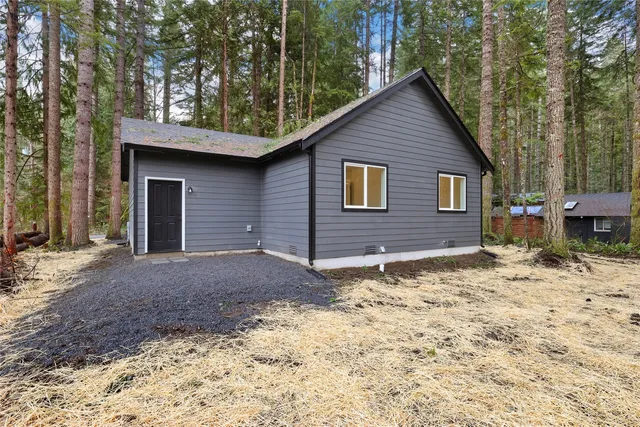 an aerial view of residential house and green space