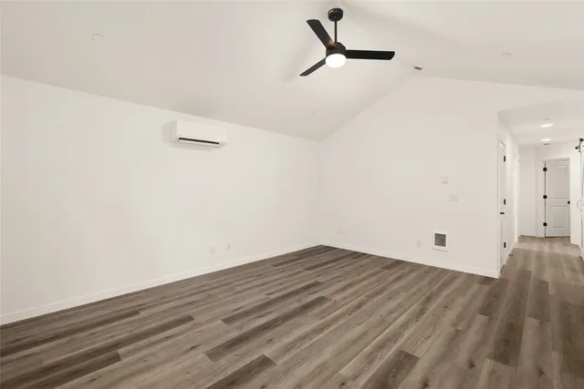a kitchen with a sink a stove a refrigerator and white cabinets