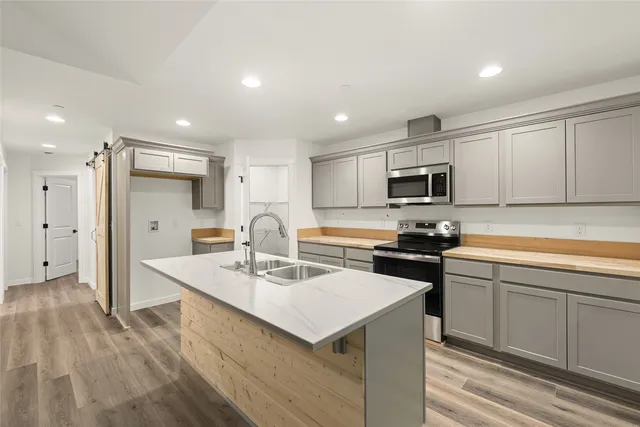 a view of a livingroom with wooden floor
