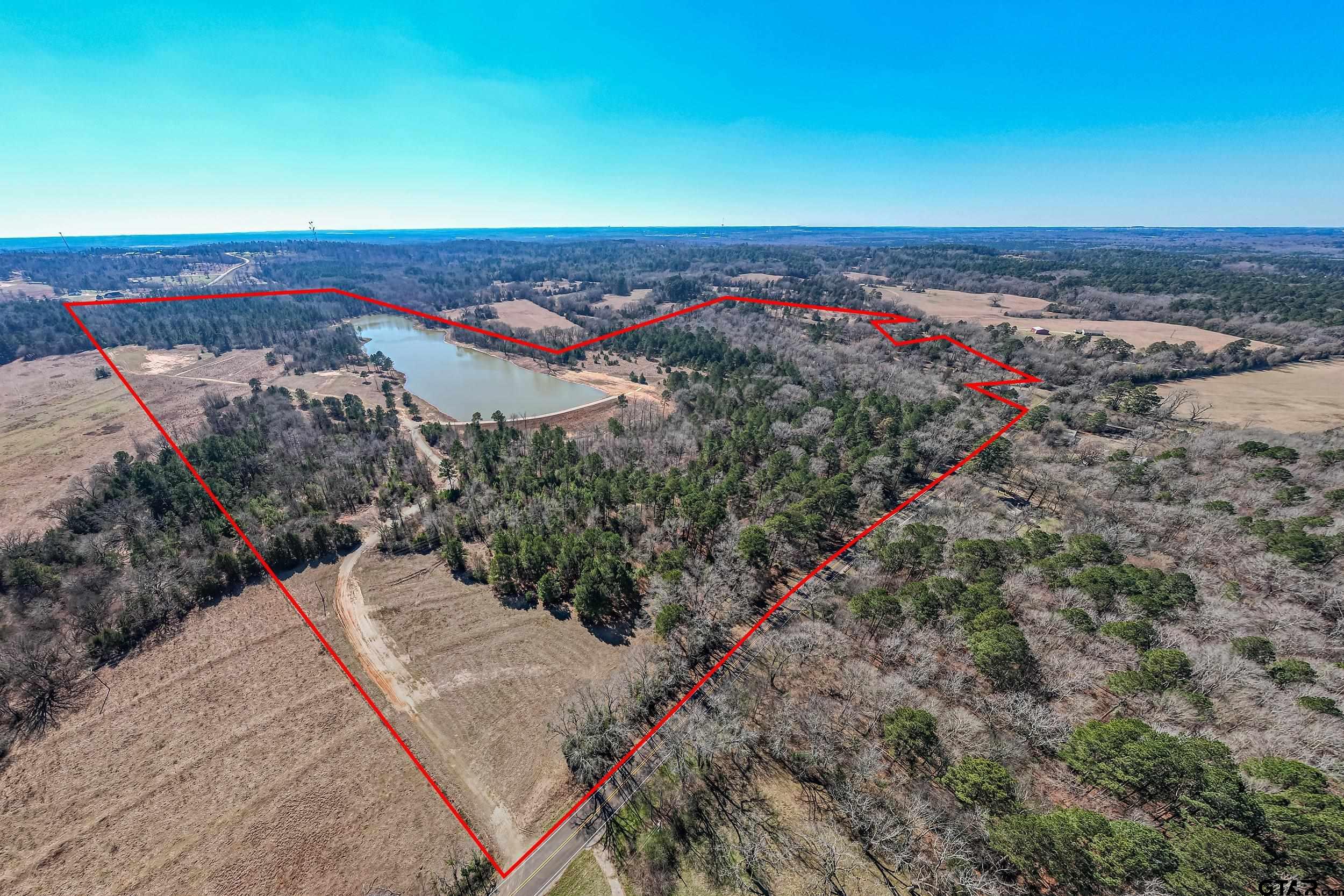 an aerial view of a houses with a yard