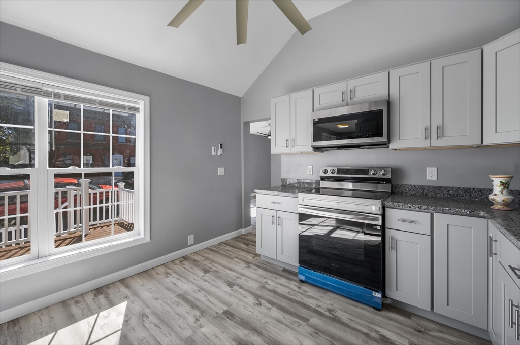 55 Mendon Street Worcester, MA 01604 - Photo 12 of 29 a kitchen with stainless steel appliances a stove microwave and sink
