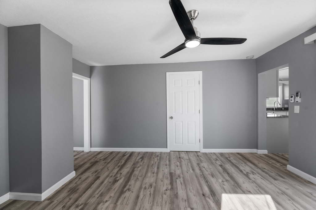 55 Mendon Street Worcester, MA 01604 - Photo 15 of 29 a view of a hallway with wooden floor and staircase