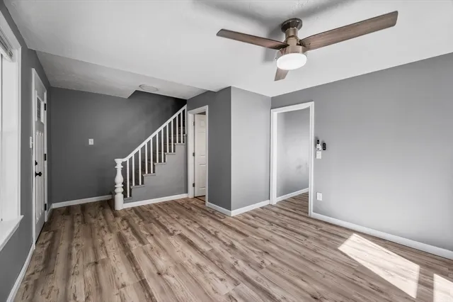 a view of entryway and hall with a chandelier