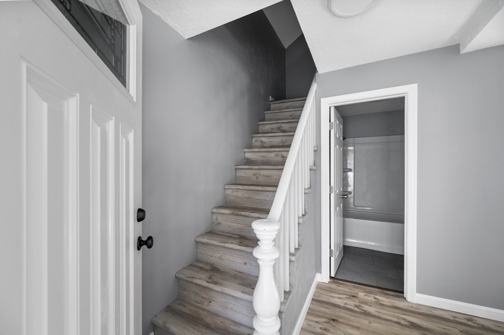 55 Mendon Street Worcester, MA 01604 - Photo 18 of 29 a view of a hallway with wooden floor and entryway