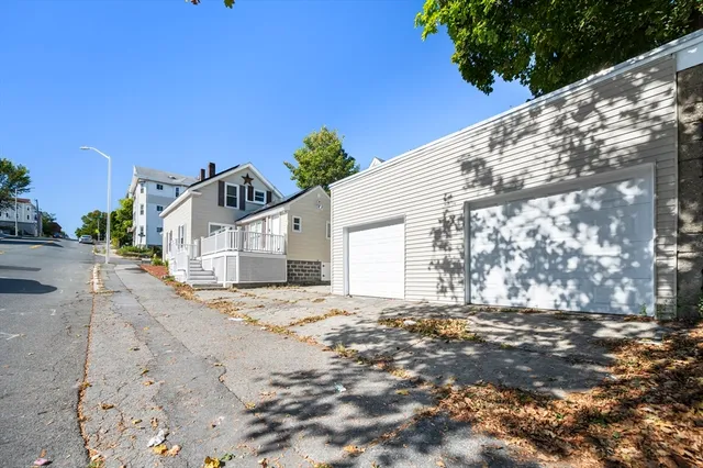 a view of a house with a snow in the yard