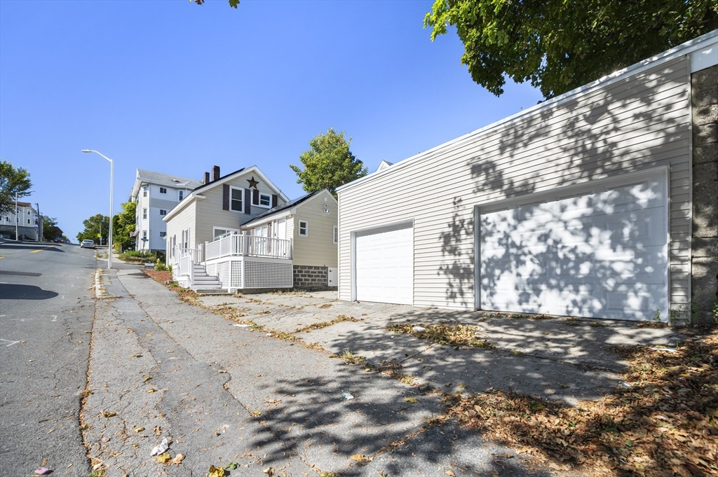 55 Mendon Street Worcester, MA 01604 - Photo 4 of 29 a view of a house with a snow in the yard