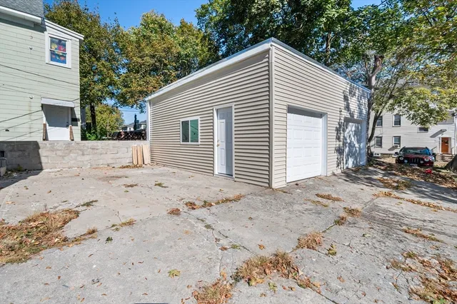 a view of a house with a snow on the road