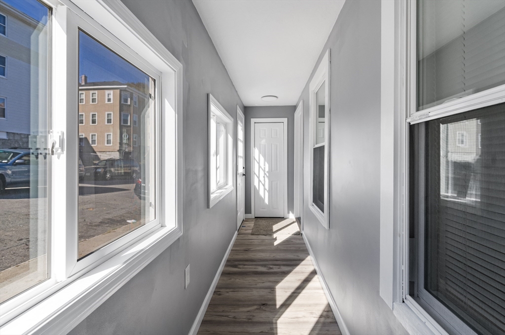 55 Mendon Street Worcester, MA 01604 - Photo 8 of 29 a view of a hallway with a glass door and outer view