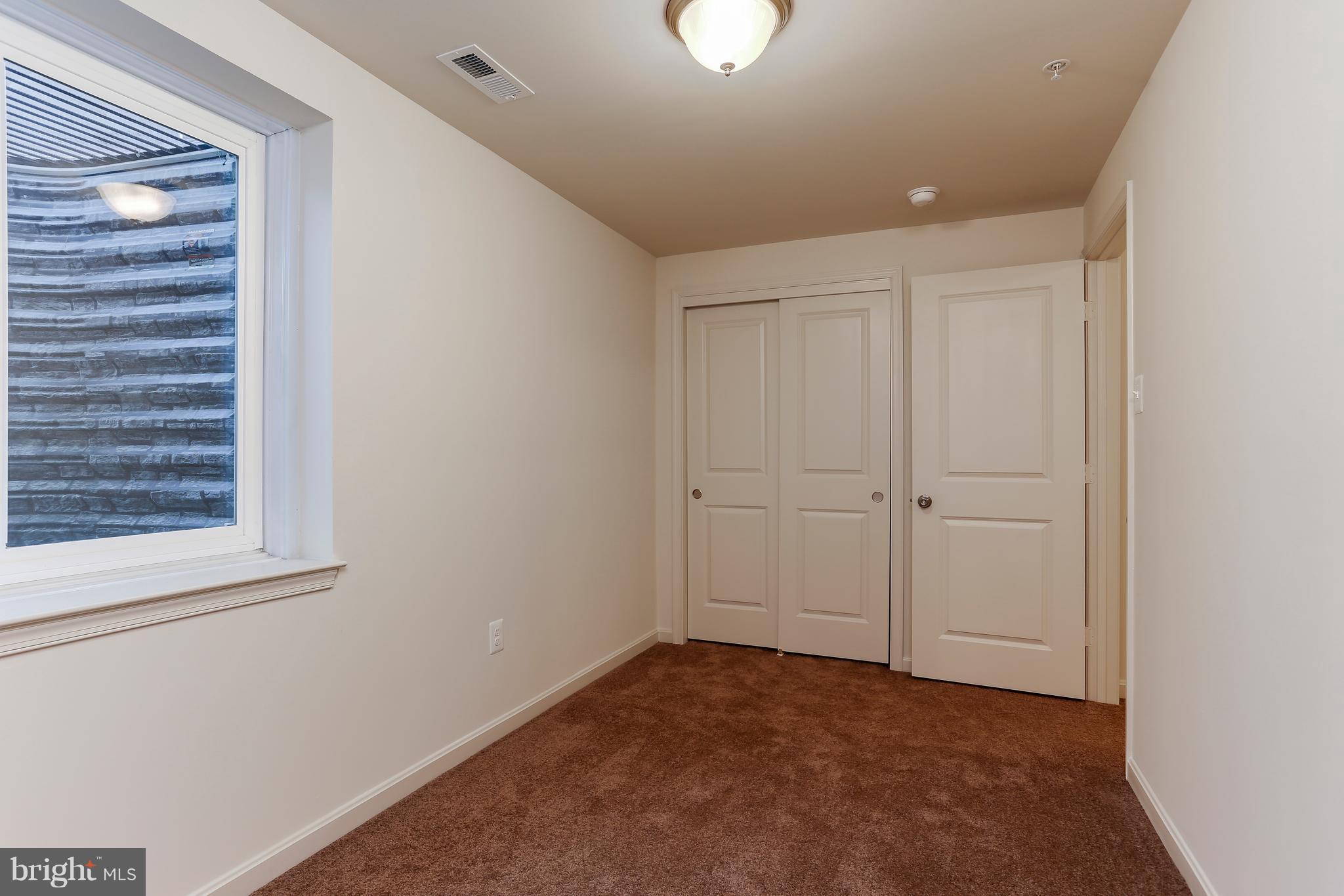 13 Back River Neck Road Baltimore, MD 21221 - Photo 11 of 30 a view of an empty room and a window