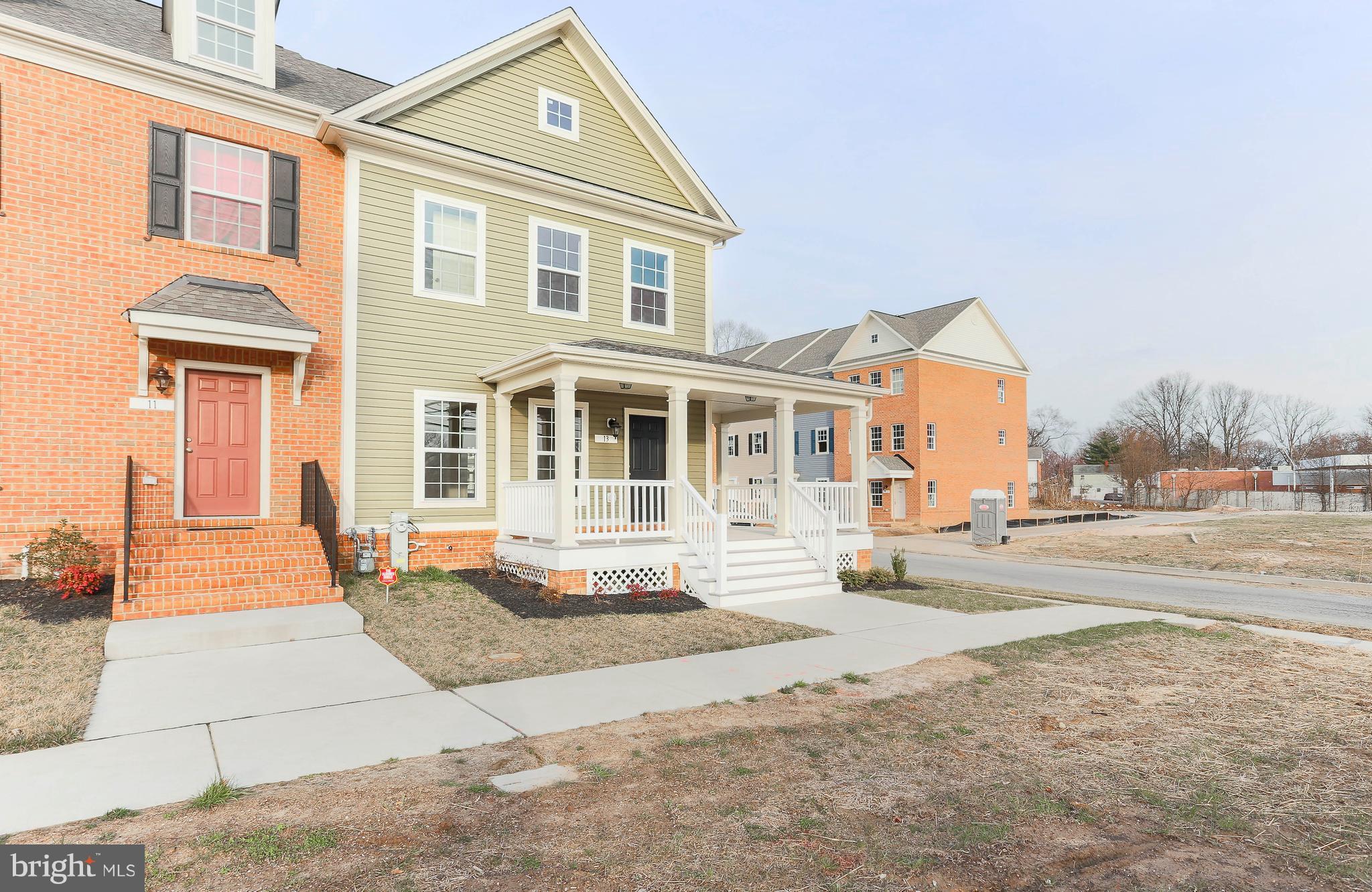 13 Back River Neck Road Baltimore, MD 21221 - Photo 3 of 30 a front view of a house with a yard