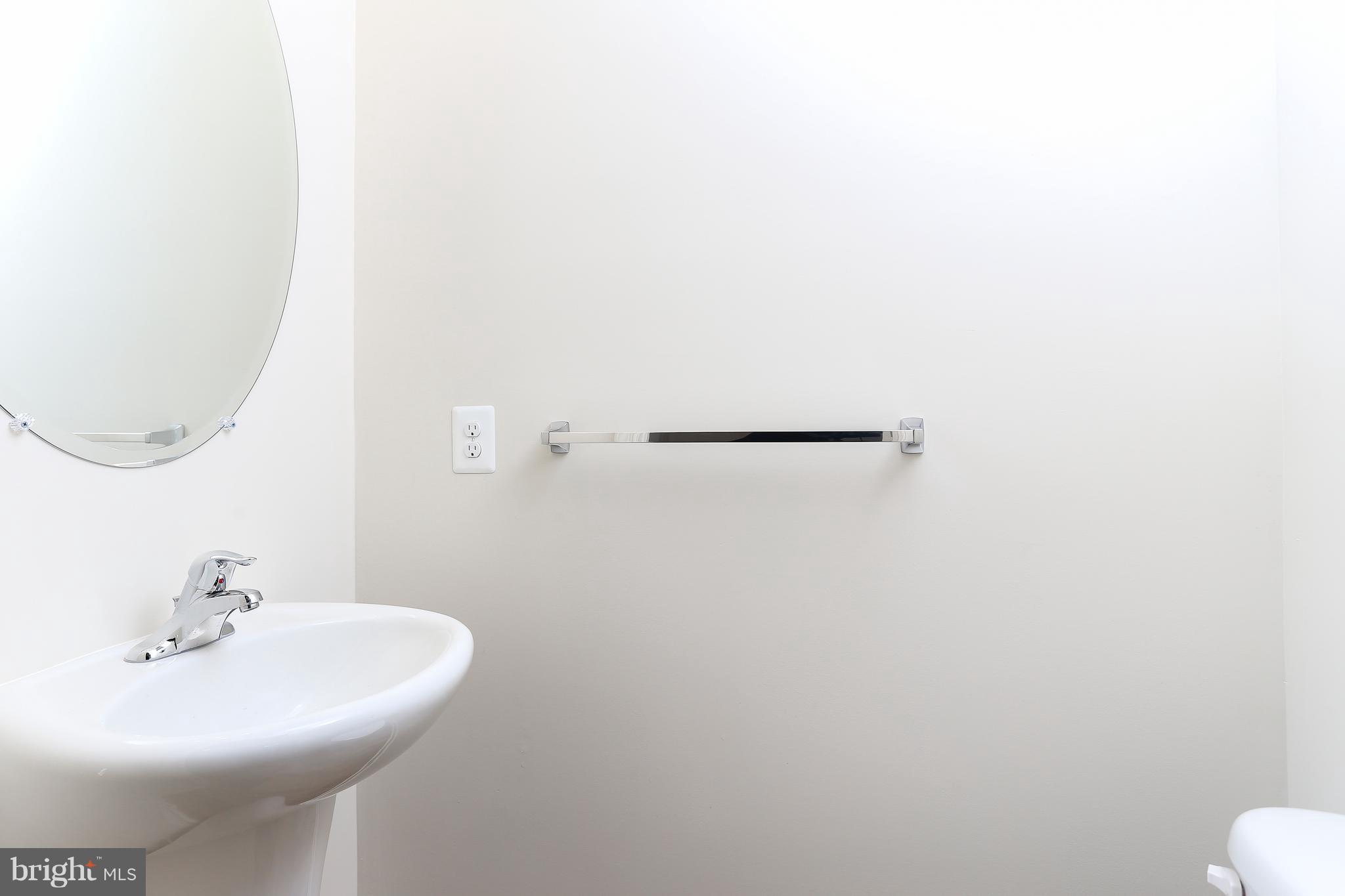 13 Back River Neck Road Baltimore, MD 21221 - Photo 24 of 30 a bathroom with a sink and a mirror