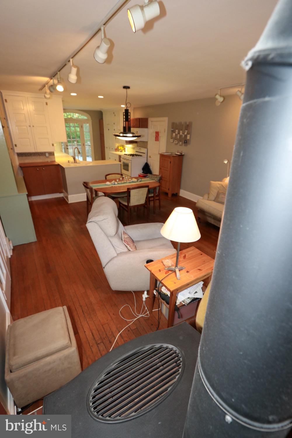 2701 Alden Road Bryn Athyn, PA 19006 - Photo 36 of 105 a living room with furniture and a dining table with kitchen view