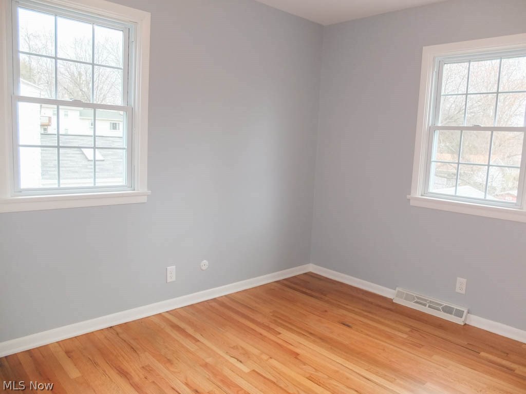 421 Holliston Road Akron, OH 44333 - Photo 14 of 22 Bedroom 4 with wood flooring.
