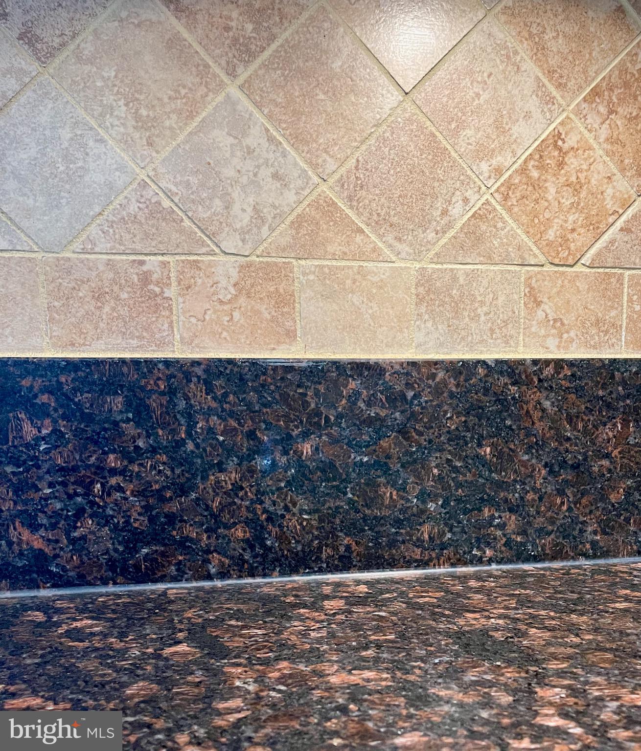 2910 Rockingham Court Pasadena, MD 21122 - Photo 41 of 59 Kitchen granite counters and tile backsplash