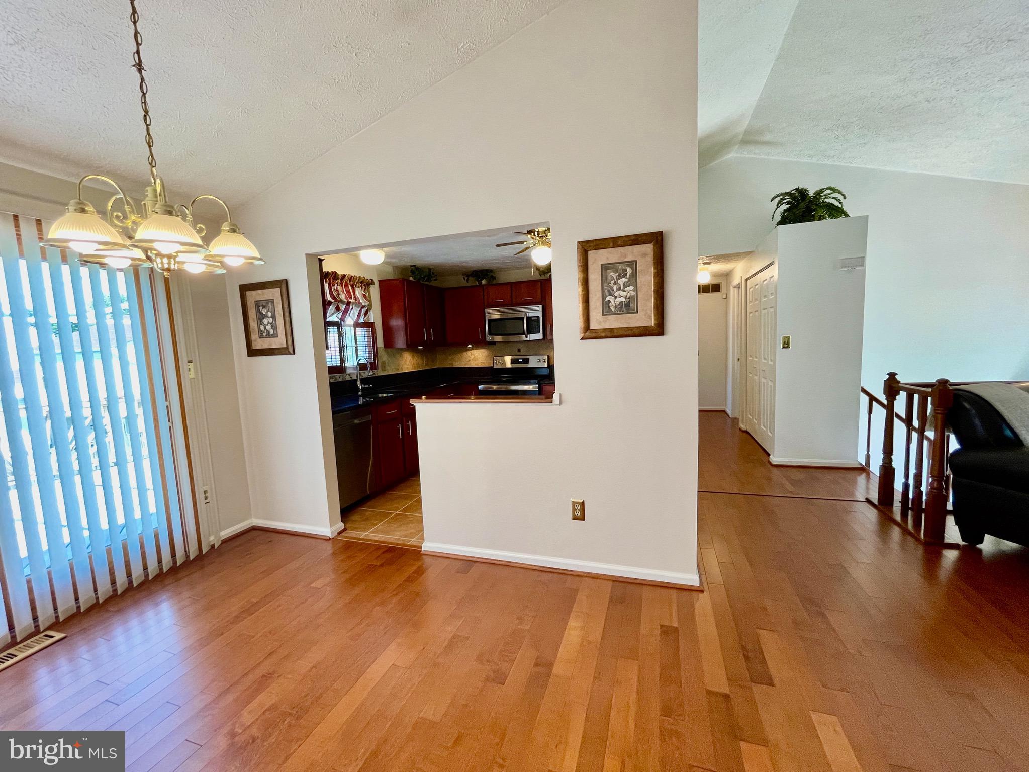 2910 Rockingham Court Pasadena, MD 21122 - Photo 45 of 59 Upper level w/vaulted ceilings and wood floors