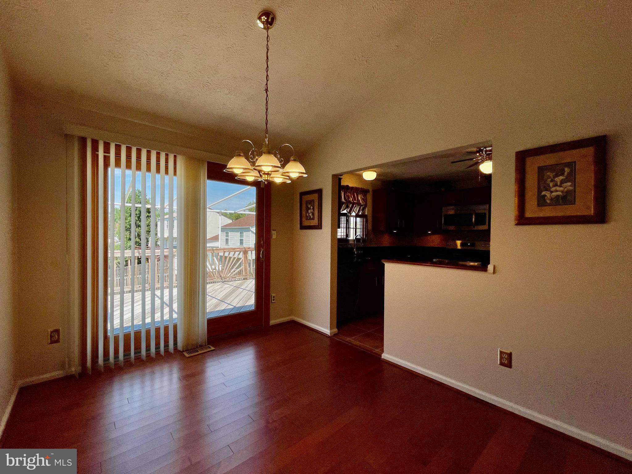 2910 Rockingham Court Pasadena, MD 21122 - Photo 46 of 59 Dining room with slider and view to rear deck