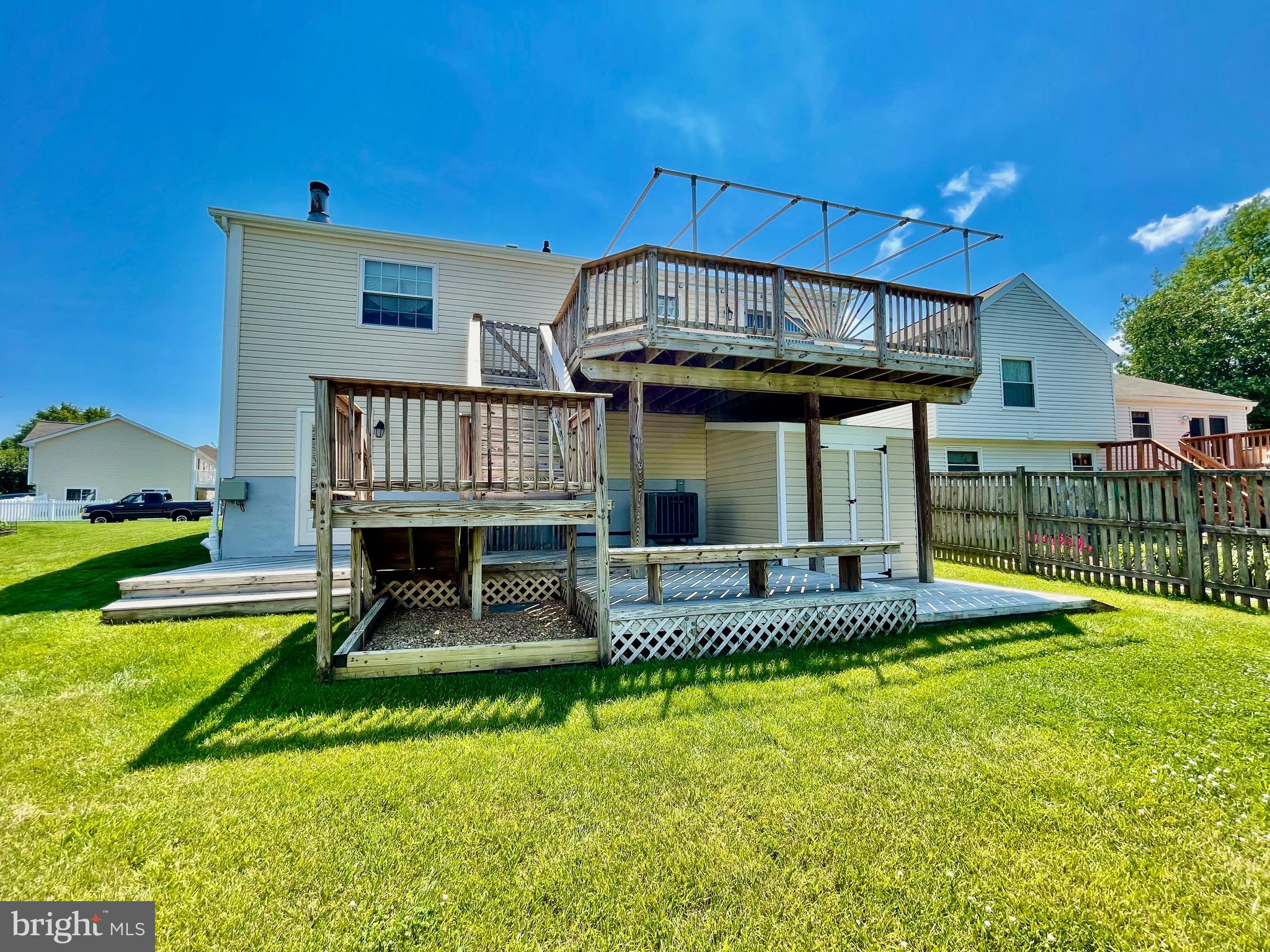 2910 Rockingham Court Pasadena, MD 21122 - Photo 53 of 59 Rear yard w/view of two level deck with awning