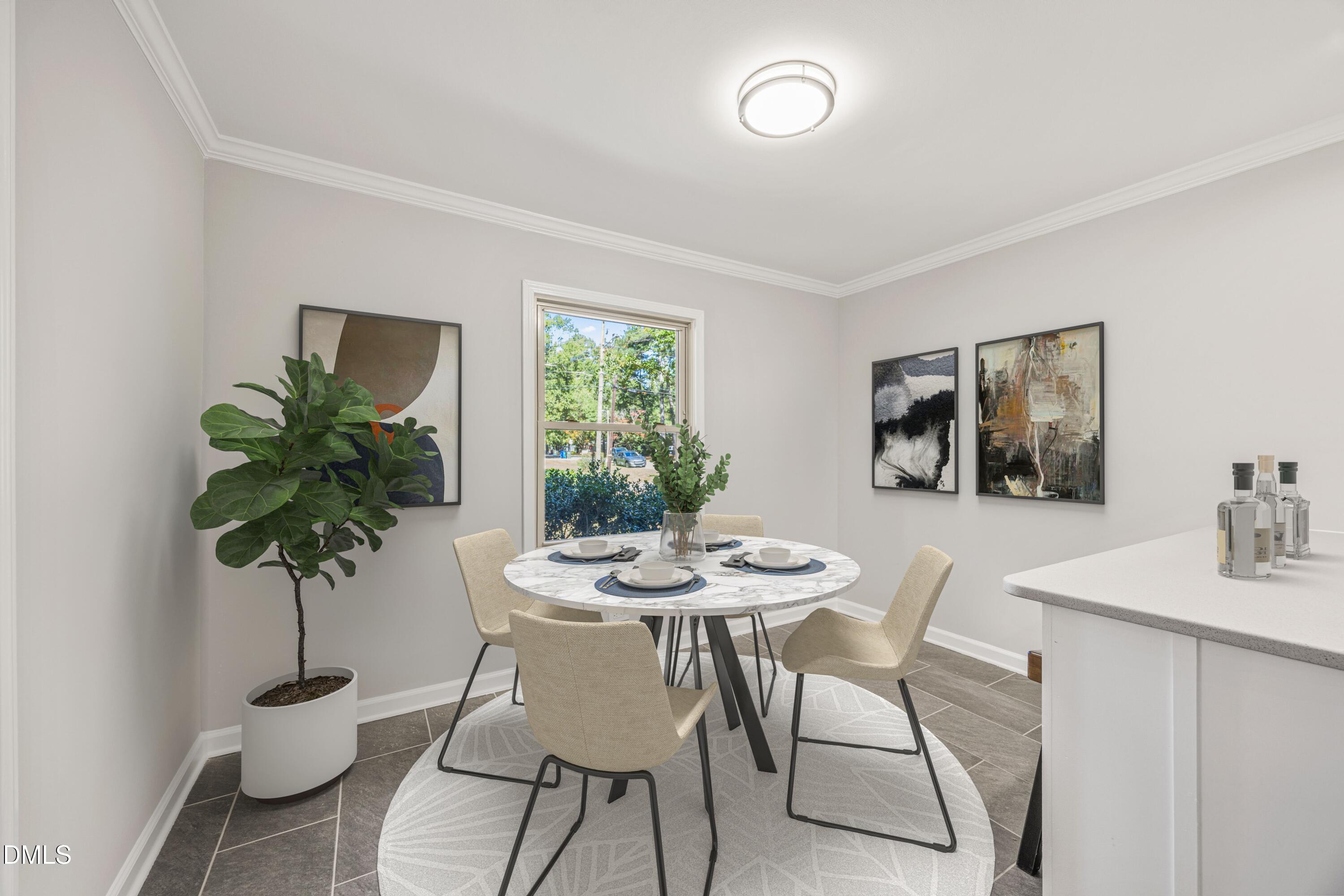 2915 Fawn Avenue Durham, NC 27705 - Photo 13 of 39 a view of a dining room with furniture window and wooden floor