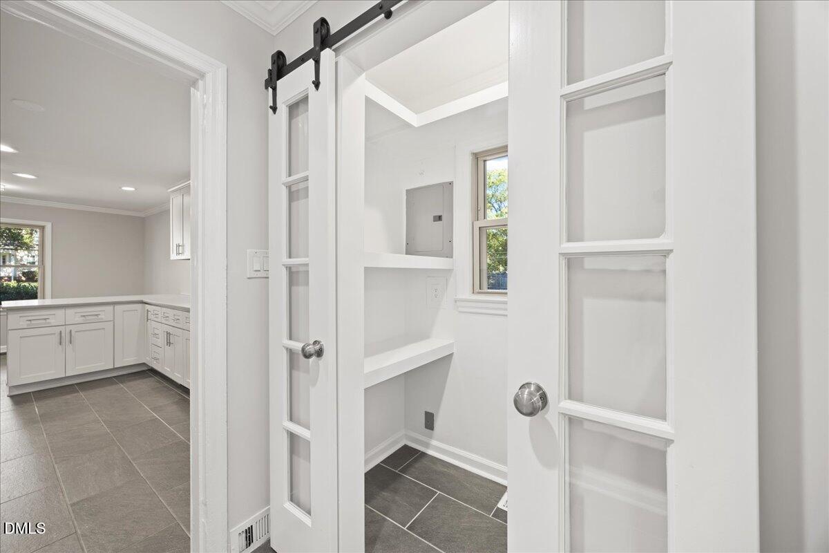 2915 Fawn Avenue Durham, NC 27705 - Photo 14 of 39 a bathroom with a shower and a glass door