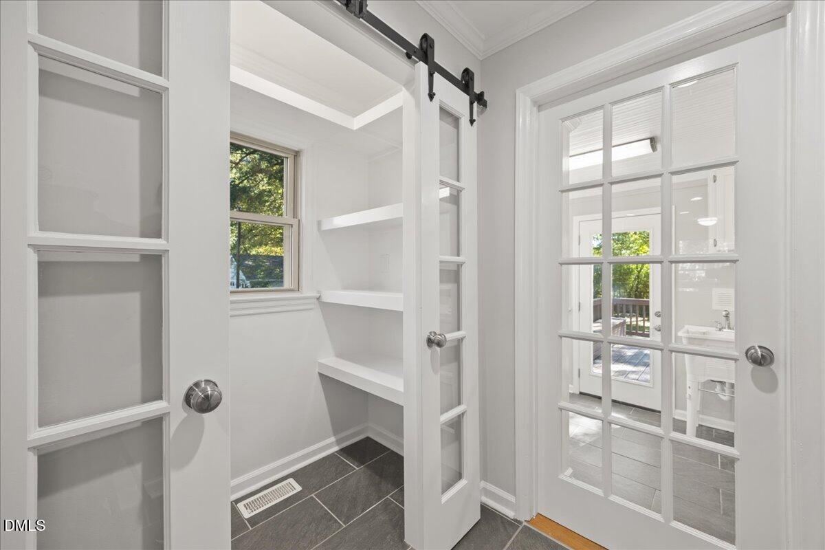 2915 Fawn Avenue Durham, NC 27705 - Photo 15 of 39 a view of walk in closet with window