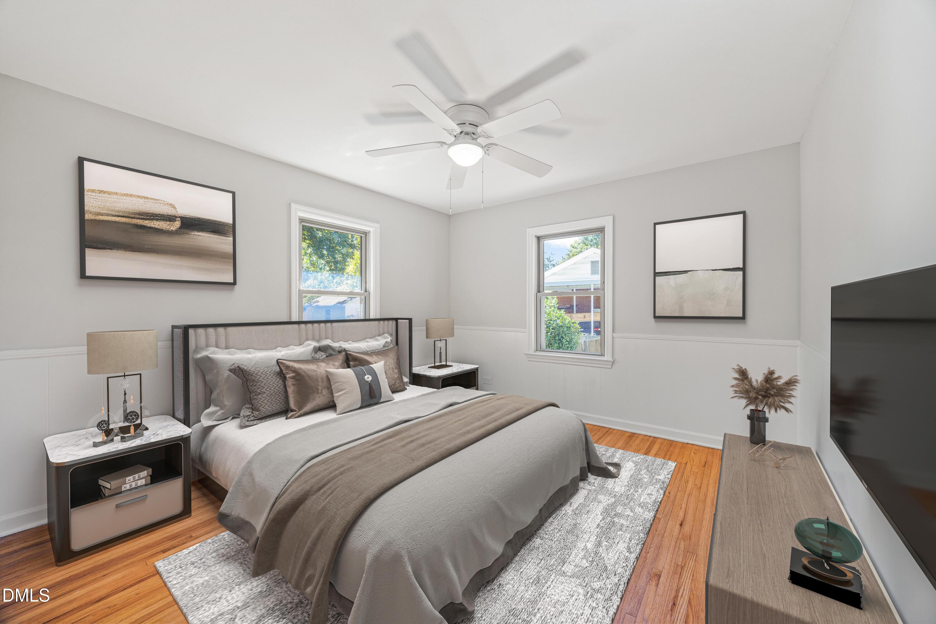 2915 Fawn Avenue Durham, NC 27705 - Photo 19 of 39 a bedroom with bed and a flat screen tv