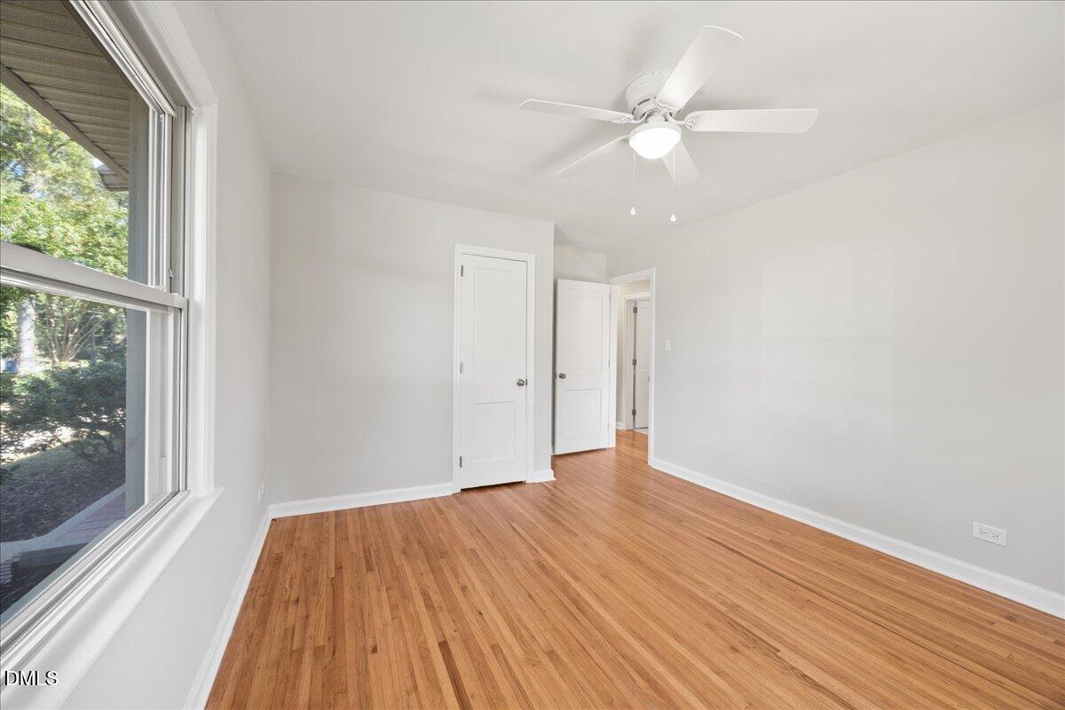 2915 Fawn Avenue Durham, NC 27705 - Photo 20 of 39 a view of an empty room with wooden floor and a window