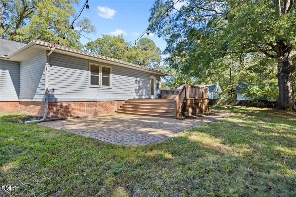 2915 Fawn Avenue Durham, NC 27705 - Photo 31 of 39 a backyard of a house with table and chairs