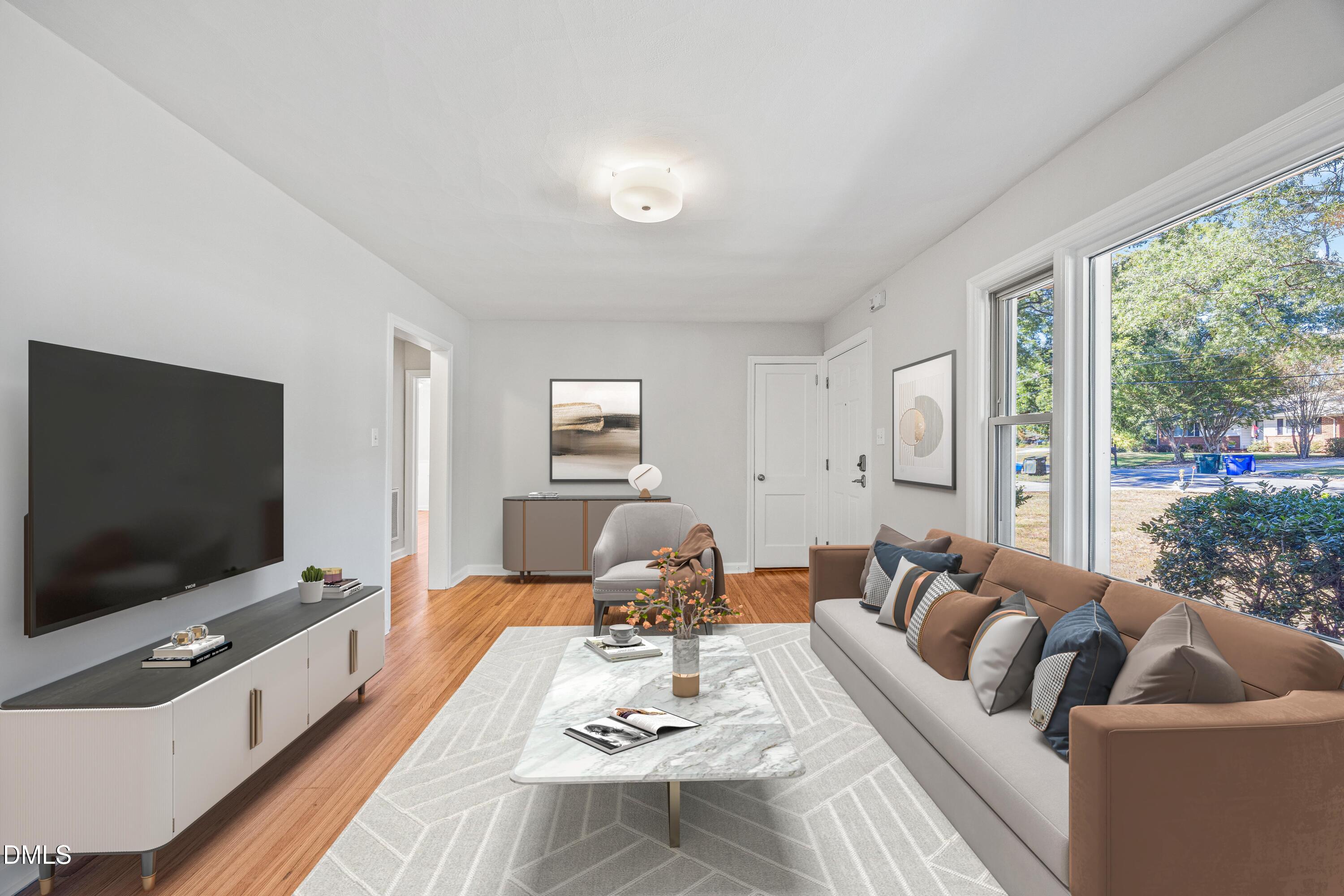 2915 Fawn Avenue Durham, NC 27705 - Photo 5 of 39 a living room with furniture and a flat screen tv