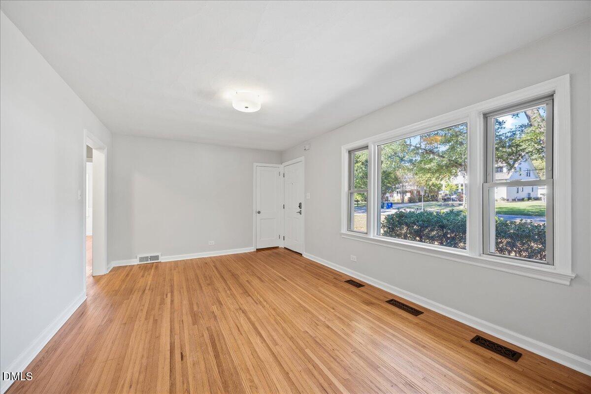 2915 Fawn Avenue Durham, NC 27705 - Photo 6 of 39 a view of empty room with wooden floor and fan