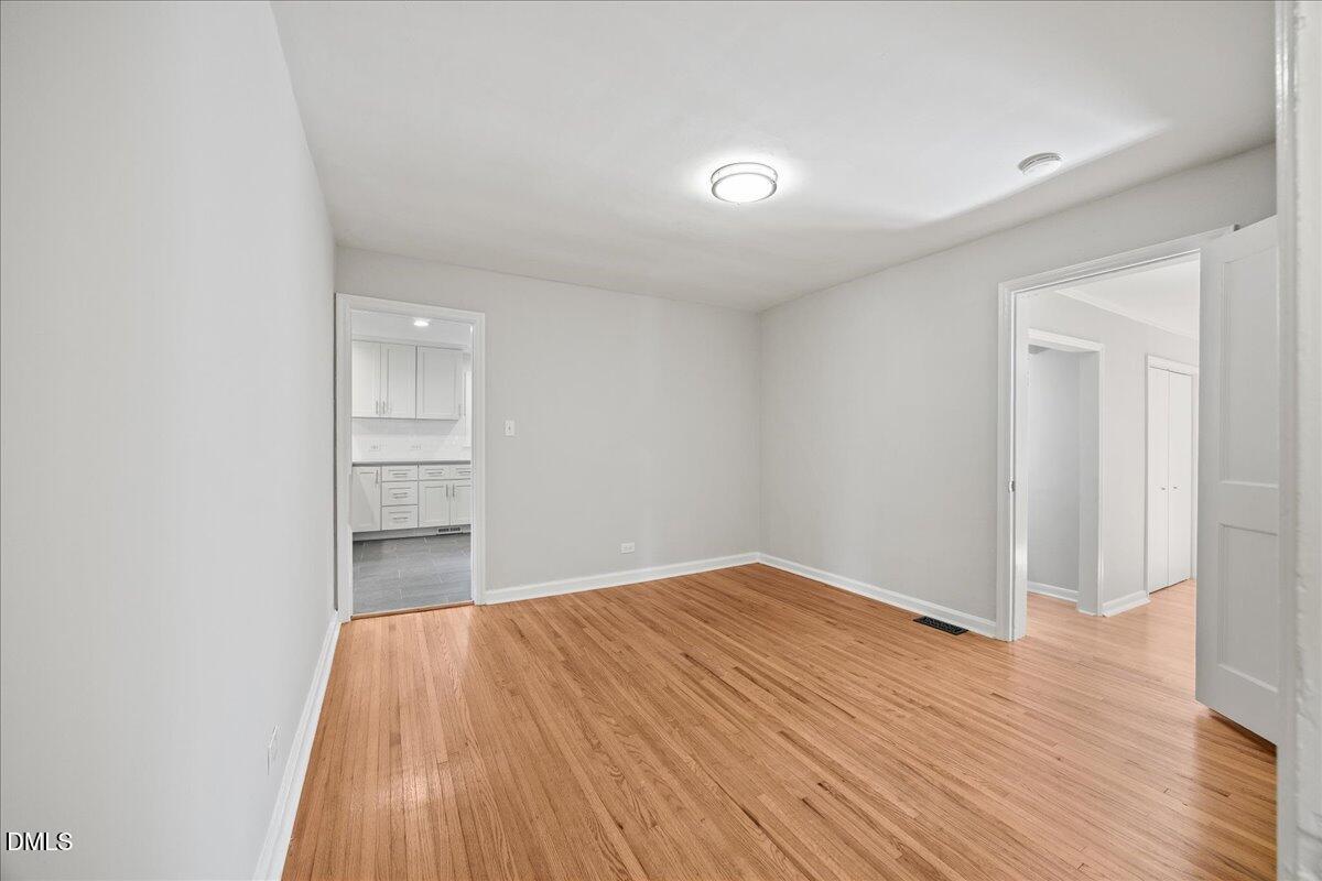 2915 Fawn Avenue Durham, NC 27705 - Photo 9 of 39 wooden floor in an empty room