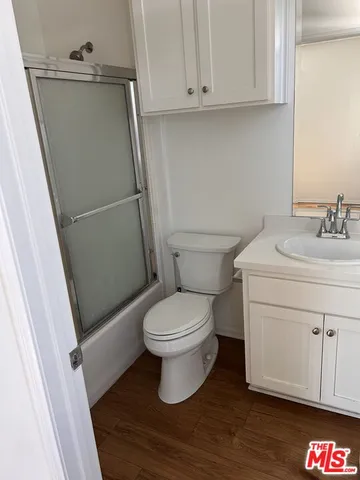 a bathroom with a toilet sink and vanity